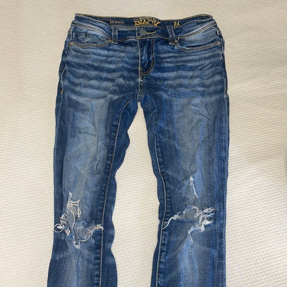 Buckle Black skinny jeans
